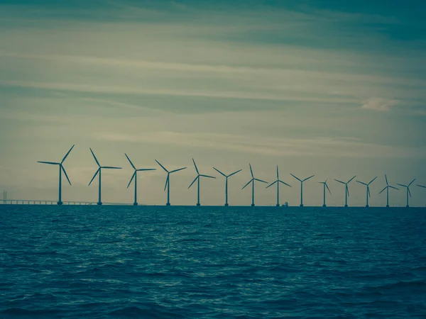 Wind turbines power generator farm along coast sea — Stock Photo, Image