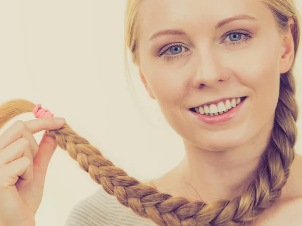 Blonde girl with long braid hair — Stock Photo, Image
