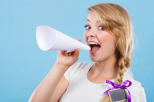 Woman screaming through megaphone made of paper — Stock Photo, Image