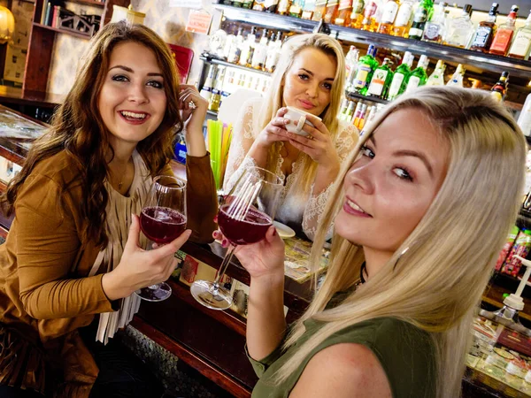 Girls with alcohol glasses in pub club — Stock Photo, Image