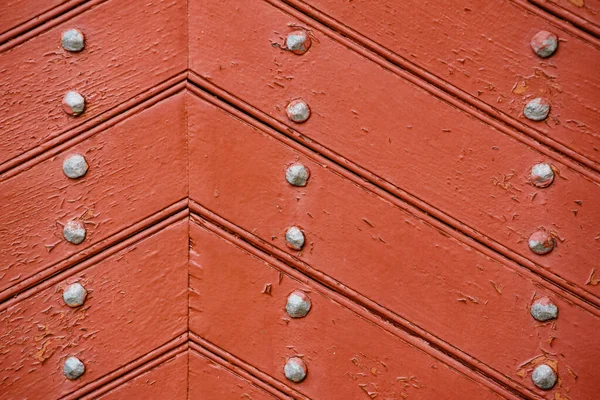 Old wooden background with metal rivets — Stock Photo, Image