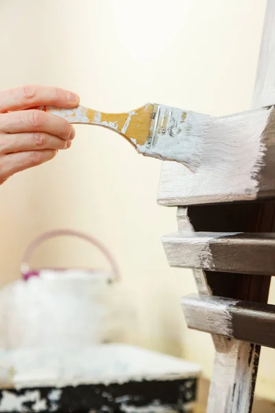 Person renovating wooden hanger — Stock Photo, Image