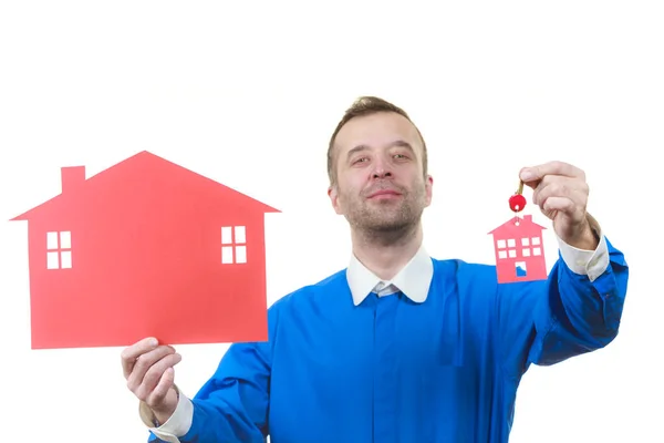 Real estate man with house model and keys — Stock Photo, Image