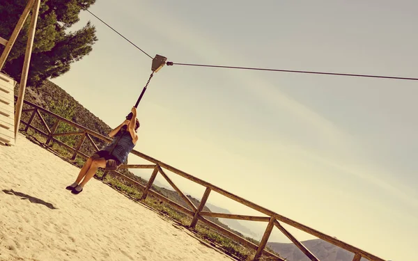 Adult woman having fun on zipline — Stock Photo, Image