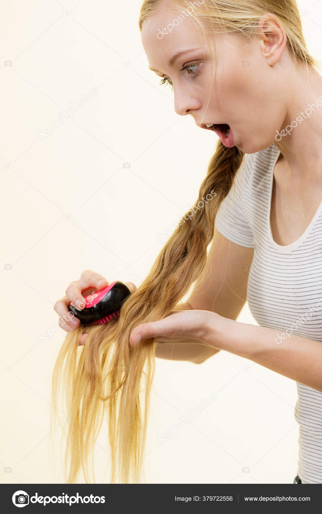 teen with hair brush