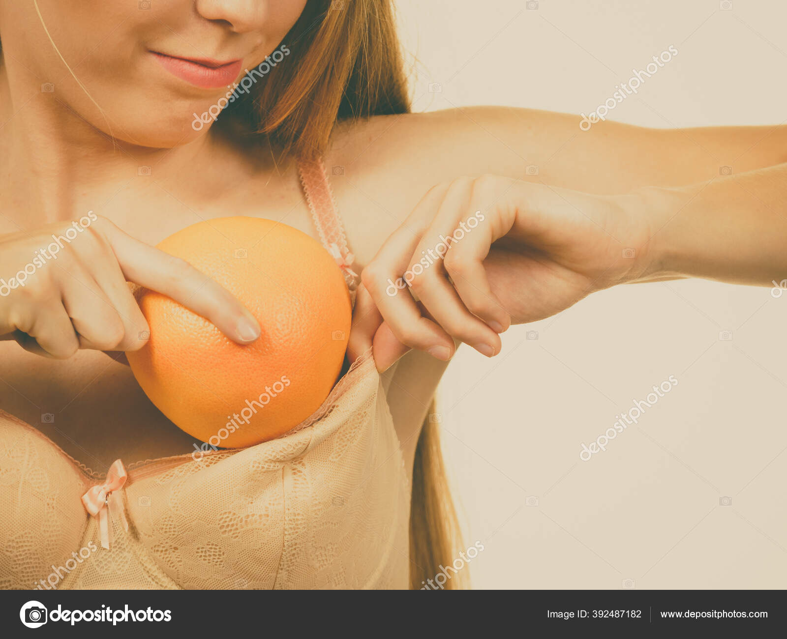 Young Woman Small Boobs Puts Big Fruit Grapefruit Her Bra Stock Photo by  ©Voyagerix 392487182