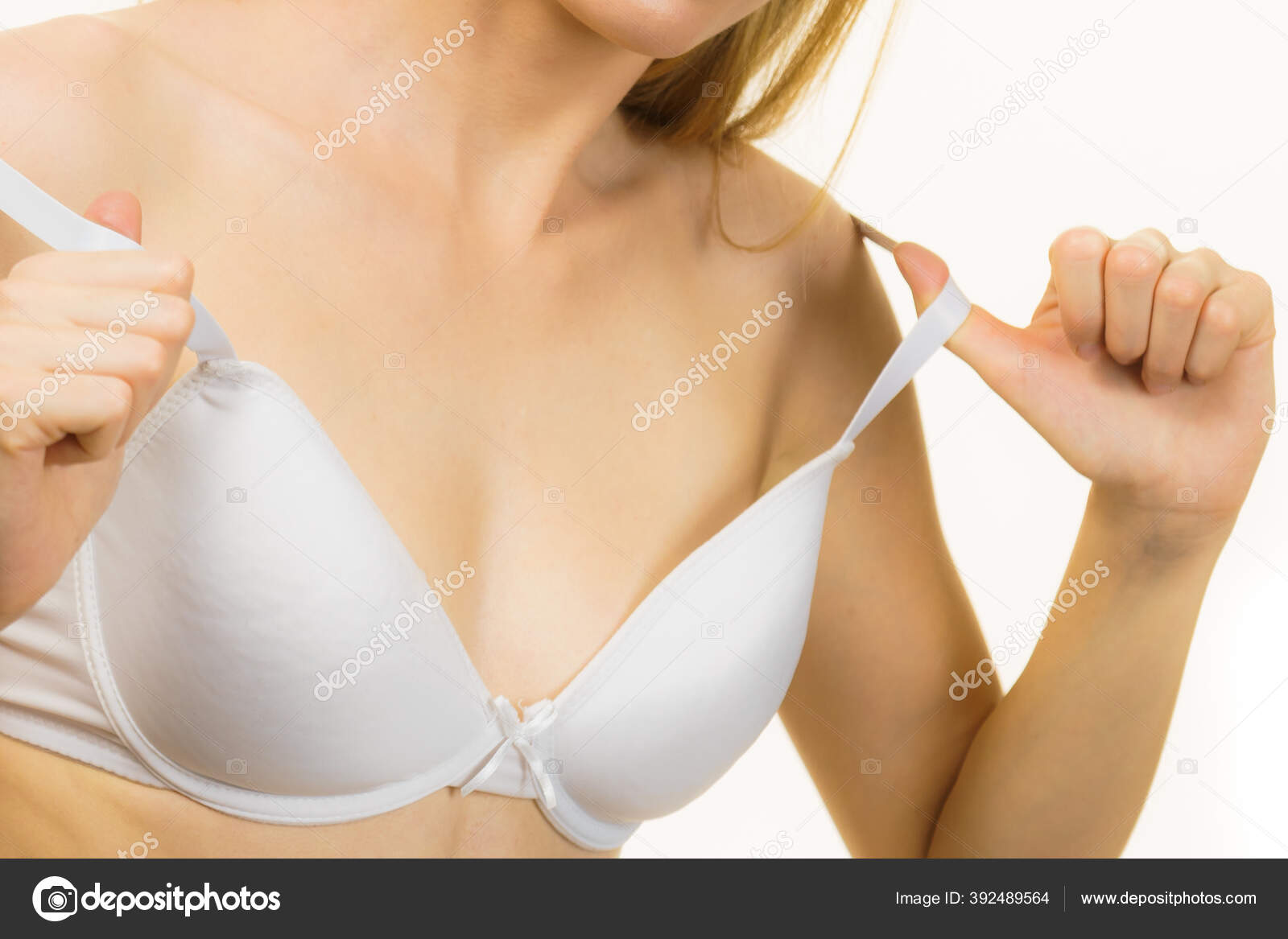 Young Woman Holding Bra Strap Straps Keep Falling Problem Female Stock  Photo by ©Voyagerix 392489564