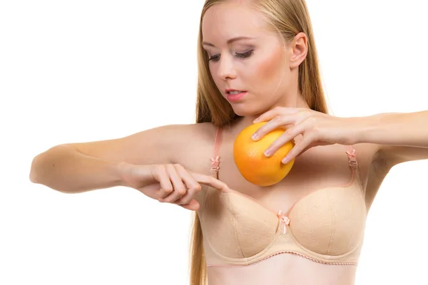 Naked woman with small breasts holding silicon breast form enlargers  enhancers Stock Photo - Alamy