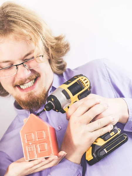 Man Doing House Renovation Guy Using Drill Small Red Home — Stock Photo, Image