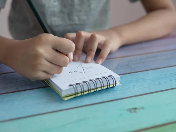 Close Asian Girl Drawing Star Notebook Colourful Table — Stock Photo, Image