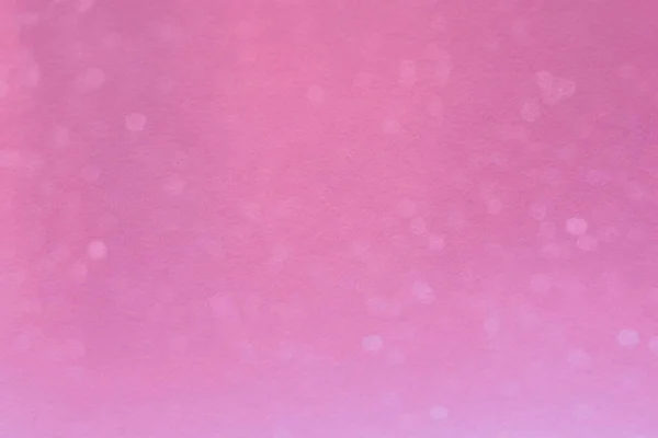Абстрактный размытый боке на розовом фоне — стоковое фото