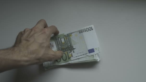 Businessmans hands counting hundred Euro bills at a table — Stock Video