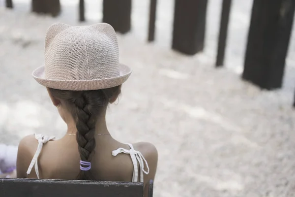 Back view of tennager girl in a stylish hat — Stock Photo, Image