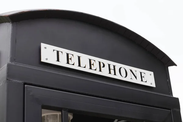 Vintage Big Black Pay Phone White Sky — Stock Photo, Image