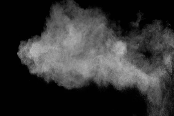 Bizarre forms of white powder explosion cloud against black background.White dust particles splash.