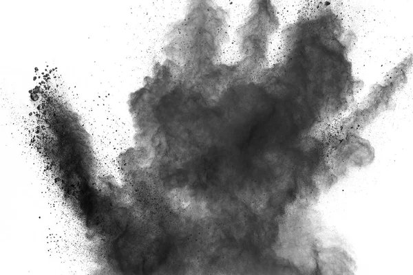 Schwarzpulver Explosion auf weißem Hintergrund. Schwarze Staubpartikel spritzen.painted holi powder festival. — Stockfoto