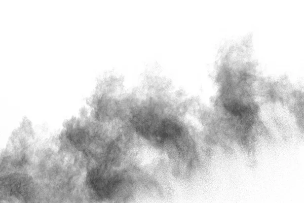 White powder explosion cloud against black background.White dust