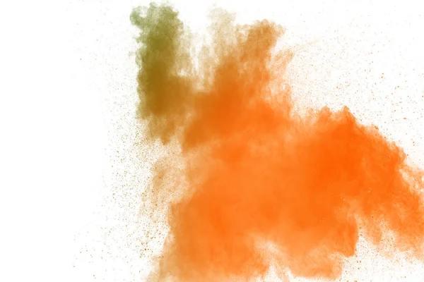 Abstract yellow orange powder explosion on white background. Freeze motion of yellow orange dust particles splash.