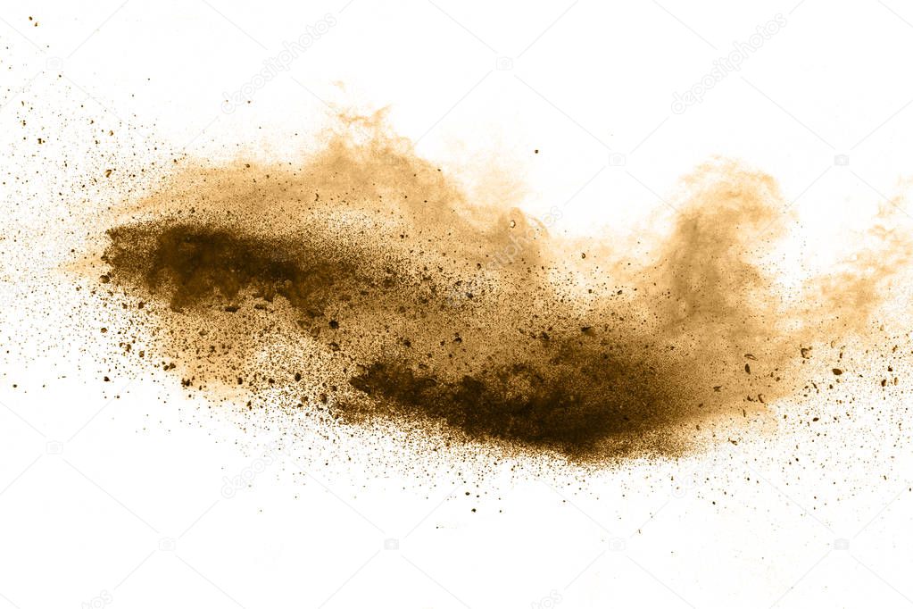 Stopping the movement of brown powder. Explosive brown powder on white background.