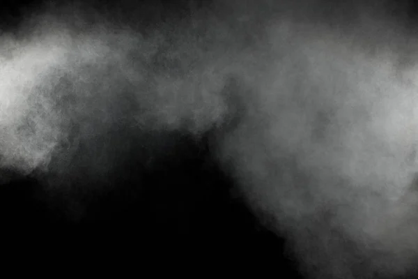 Abstract white powder explosion on a black background.Freeze motion of  white powder splash.