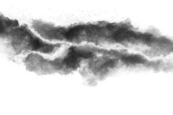 Black powder explosion on white background.Black dust particles splash.