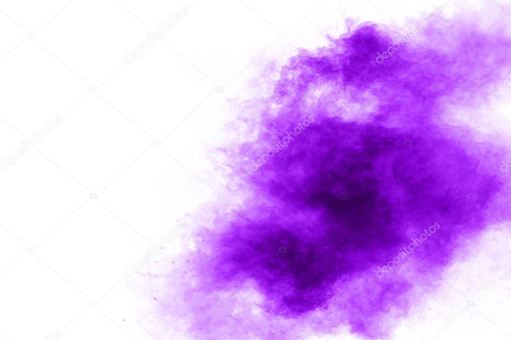 Abstract purple powder explosion on white background, Freeze motion of purple dust splashing.