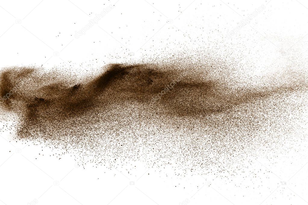 Deep Brown particles splattered on white background. Brown dust splash.