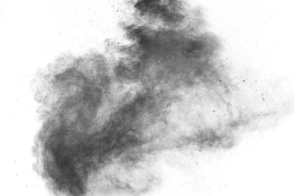 黒い粒子が白い背景に広がっている 黒色火薬の塵が爆発 — ストック写真