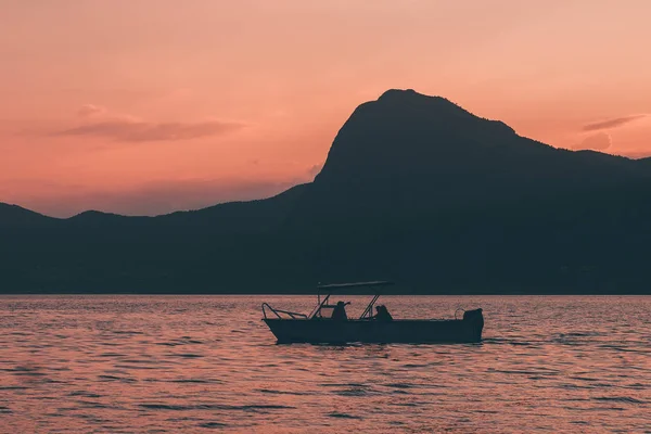 https://st4.depositphotos.com/17355508/20433/i/450/depositphotos_204333174-stock-photo-two-men-fishing-boat-sunset.jpg