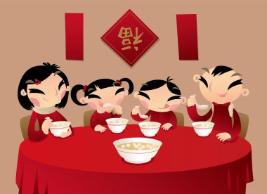 Çinli bir aile birlikte tatlı pirinç unu köfte (festival tatlı) beslenme ile onların aile zaman sahiptir.