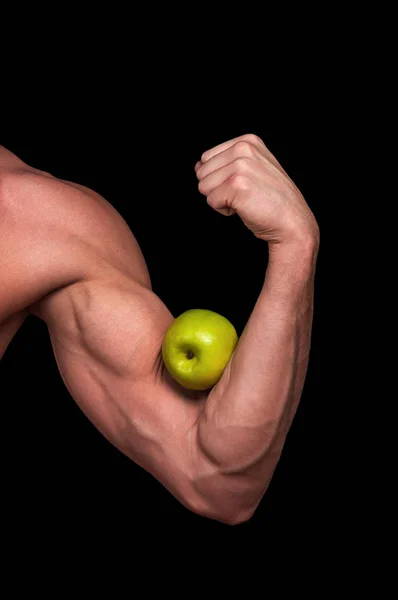 Ruka Mladého Sportovce Držícího Jablko Bicepsem — Stock fotografie