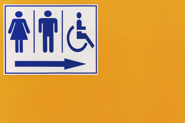 Equality in society is a matter for concern, Symbols represent communication, Describe the content that you want to present, toilet sign on orange wall
