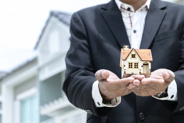 Businesses Buying Selling Homes Businessmen Models House Put Hand Backdrop — Stock Photo, Image