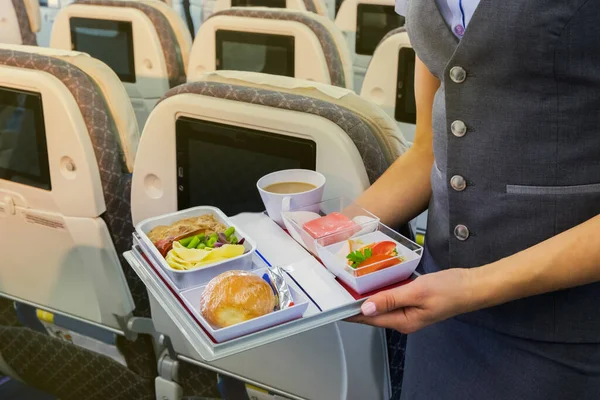 Flight Attendant Serving Meal Airplane — Stock Photo, Image