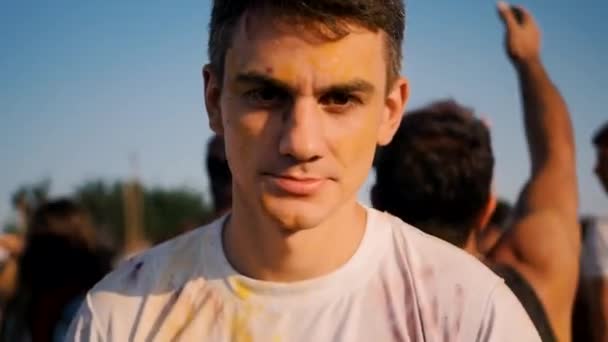 Closeup of young man having fun on the Holi Festival — Stock Video