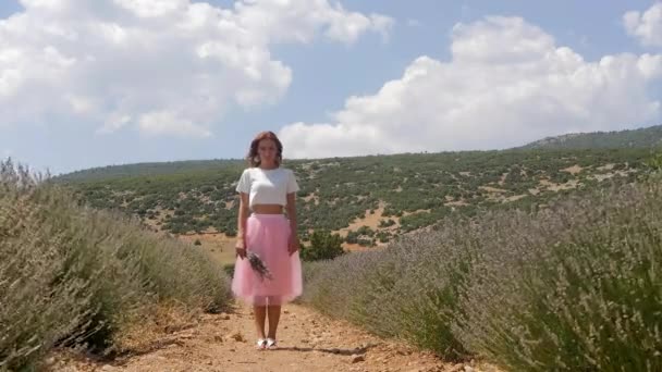 Young woman standing in the lavender field — Stok video