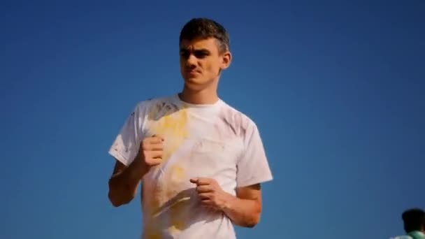 Closeup of young man having fun on the Holi Festival — Stock Video