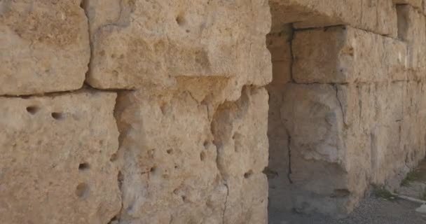 Walking through ancient arch in the wall in Ancient city Perge, open air antique historical museum — Stock Video