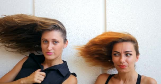 Two young woman with flying hair — Stock Video