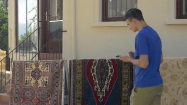 Young man walking with phone map