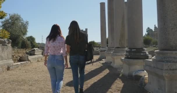 Walking with map in Ancient city Perge, open air antique historical museum — Stock Video