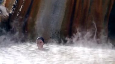 Woman in hot spring geothermal pool