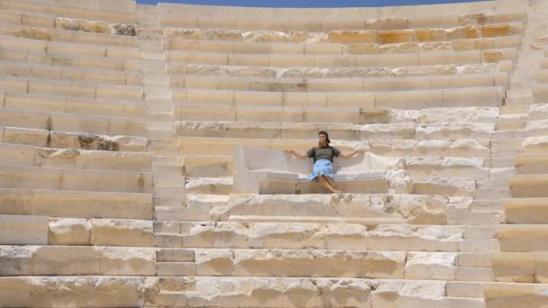 Young pretty girl in an ancient greek theater — Stockvideo