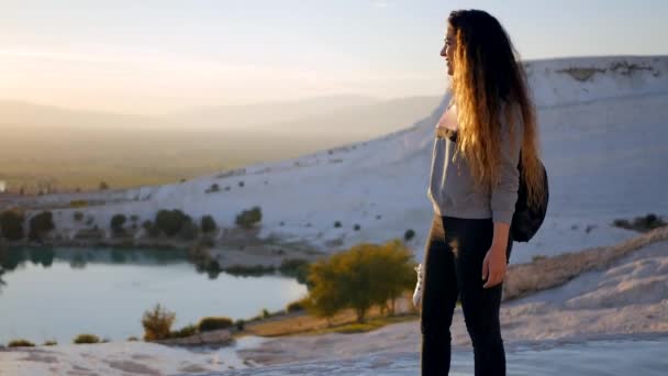 Young woman walking in Pamukkale terraces — Stockvideo