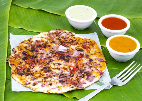 South Indian Food Uttapam Also Know As ooththappam, Rava Uttapam, Uttapa or Uthappa is a Popular South Indian Delicious Spicy Breakfast Snack Served with Coconut Chutney, Tomato Sauce and Sambar