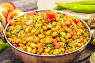 Hint mutfağı Rajma Masala veya Rajmah bir Güney Asya Vejetaryen yemek oluşan, Beyaz Barbunya fasulyesi içinde kalın et suyu ile birçok Hint tüm baharatlar ve genellikle Çapati ve gıda ile servis