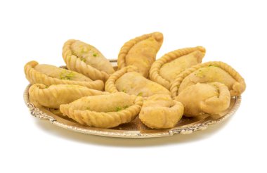 Gujiya or Gujia is a indian sweet dumpling made with suji, Maida or wheat flour and stuffed with khoya. It is common in North India, particularly in Bihar, Uttar Pradesh, Madhya Pradesh or Rajasthan clipart