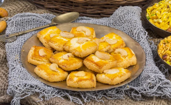 Special Freshly Sweet Cashew Nut Cookies or Biscuits Served in Plate Also Know as in India Nan Khatai, Kaju Cookies or Kaju Biscuits on Vintage Background