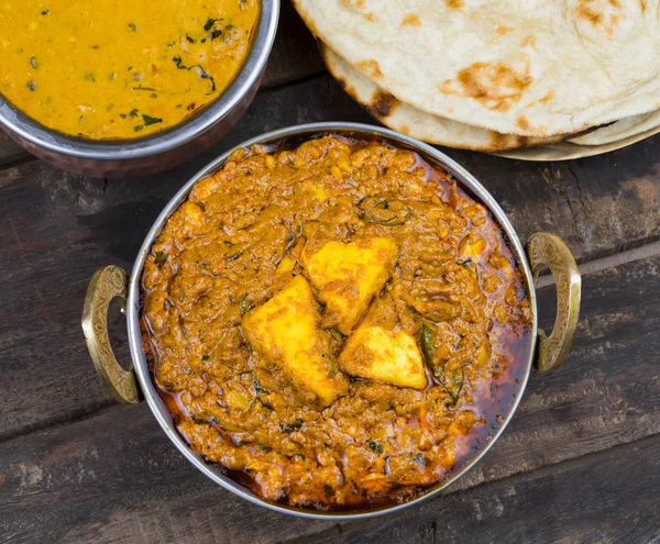 Indian Cuisine Kadai Paneer Served With Dal Makhani or Tandoori Also Know as Kadhai Paneer or Karahi Paneer is an Indian Dish of Marinated Paneer Cheese Served in a Spiced Gravy on Wooden Background