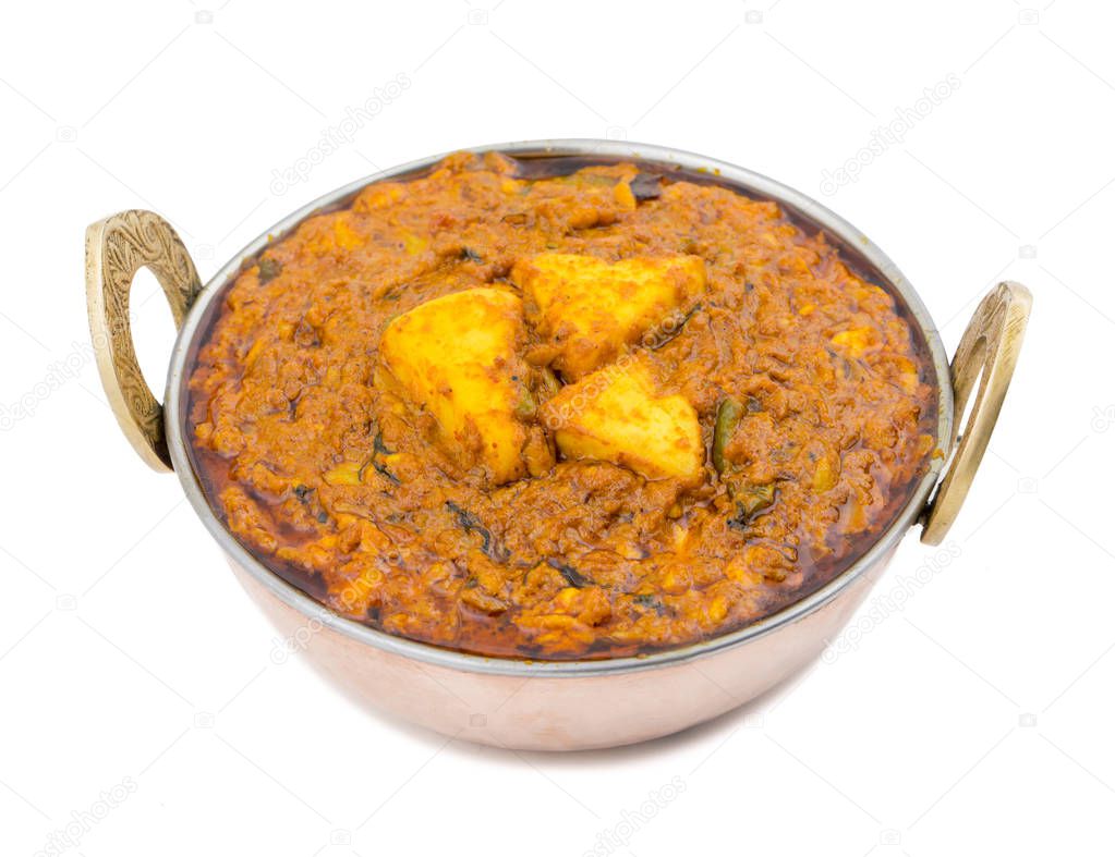 Indian Vegetarian Cuisine Kadai Paneer Also Know as Kadhai Paneer or Karahi Paneer is an Indian Dish of Marinated Paneer Cheese Served in a Spiced Gravy isolated on White Background